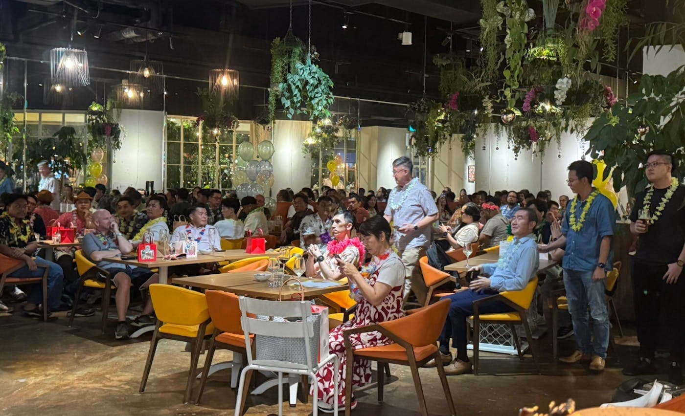 A full dining room of guests at a large event