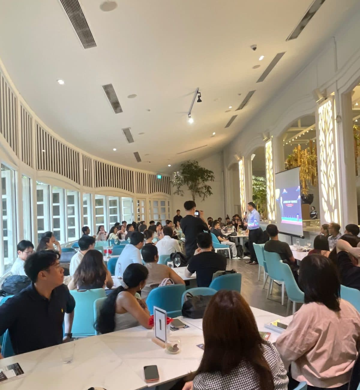 A seminar under way in the private dining room at Canopy Changi Village, screen at the front
