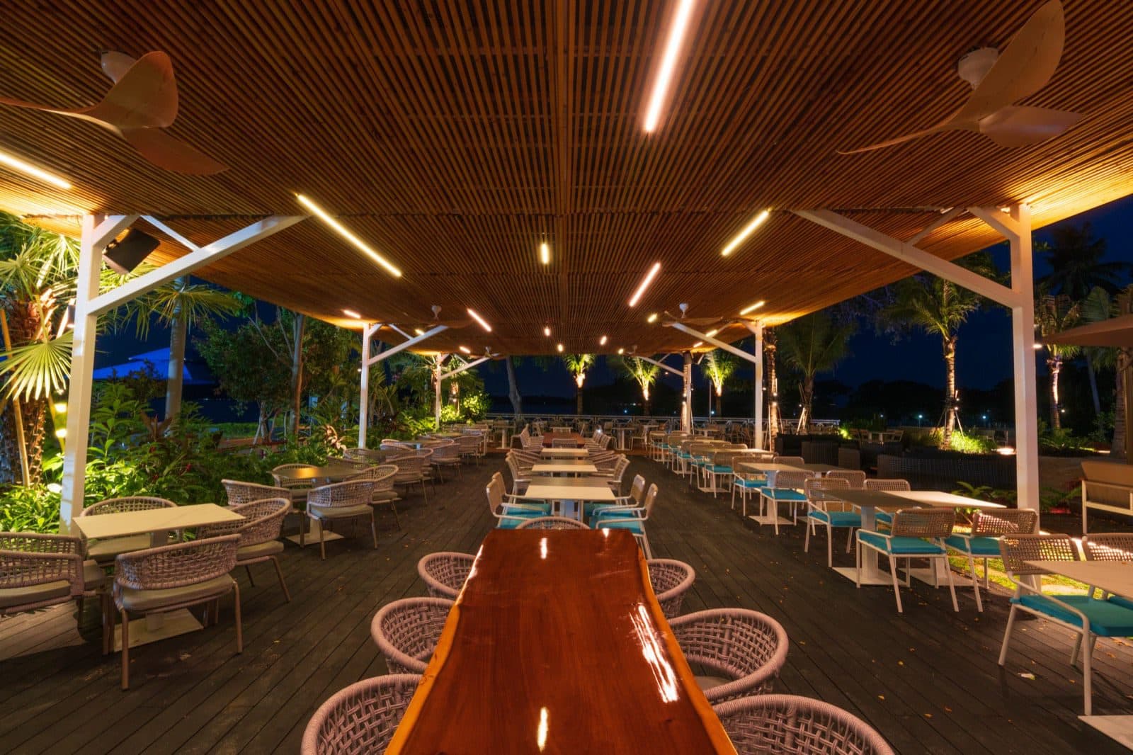 Long tables filling the room at a Canopy Changi Village celebration