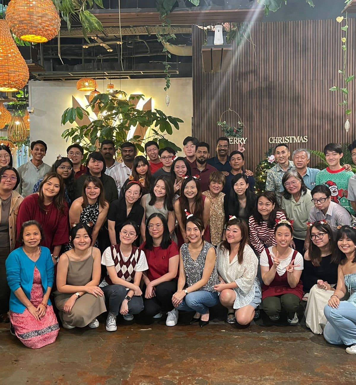 A company group photographed together at Canopy Changi City Point