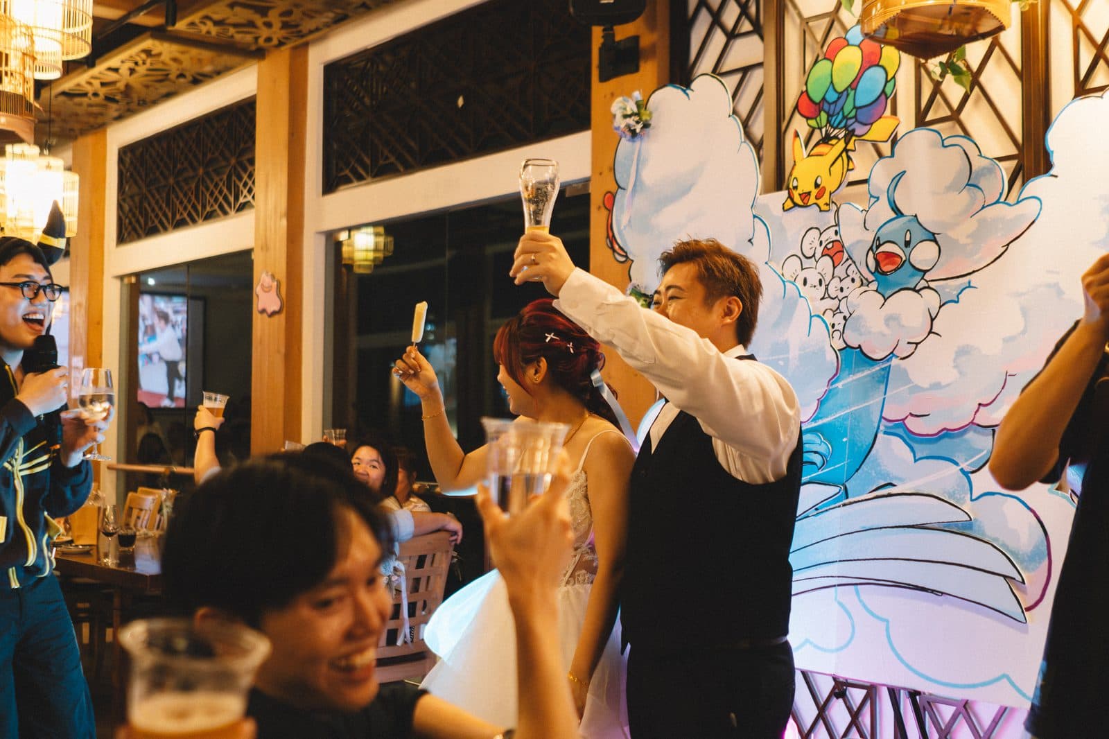 Guests raising a toast under the covered pavilion at a Canopy Jurong Lake Gardens wedding