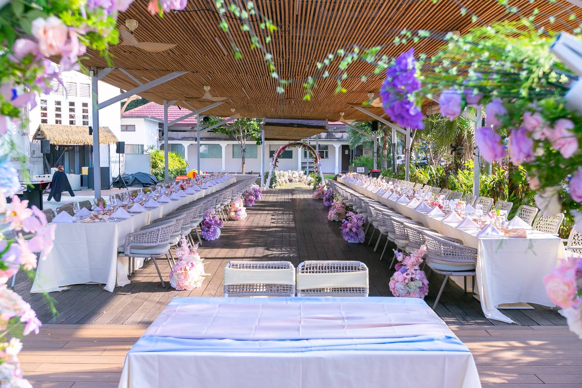The pavilion at Canopy Changi Village set for the showcase, long tables under pastel florals